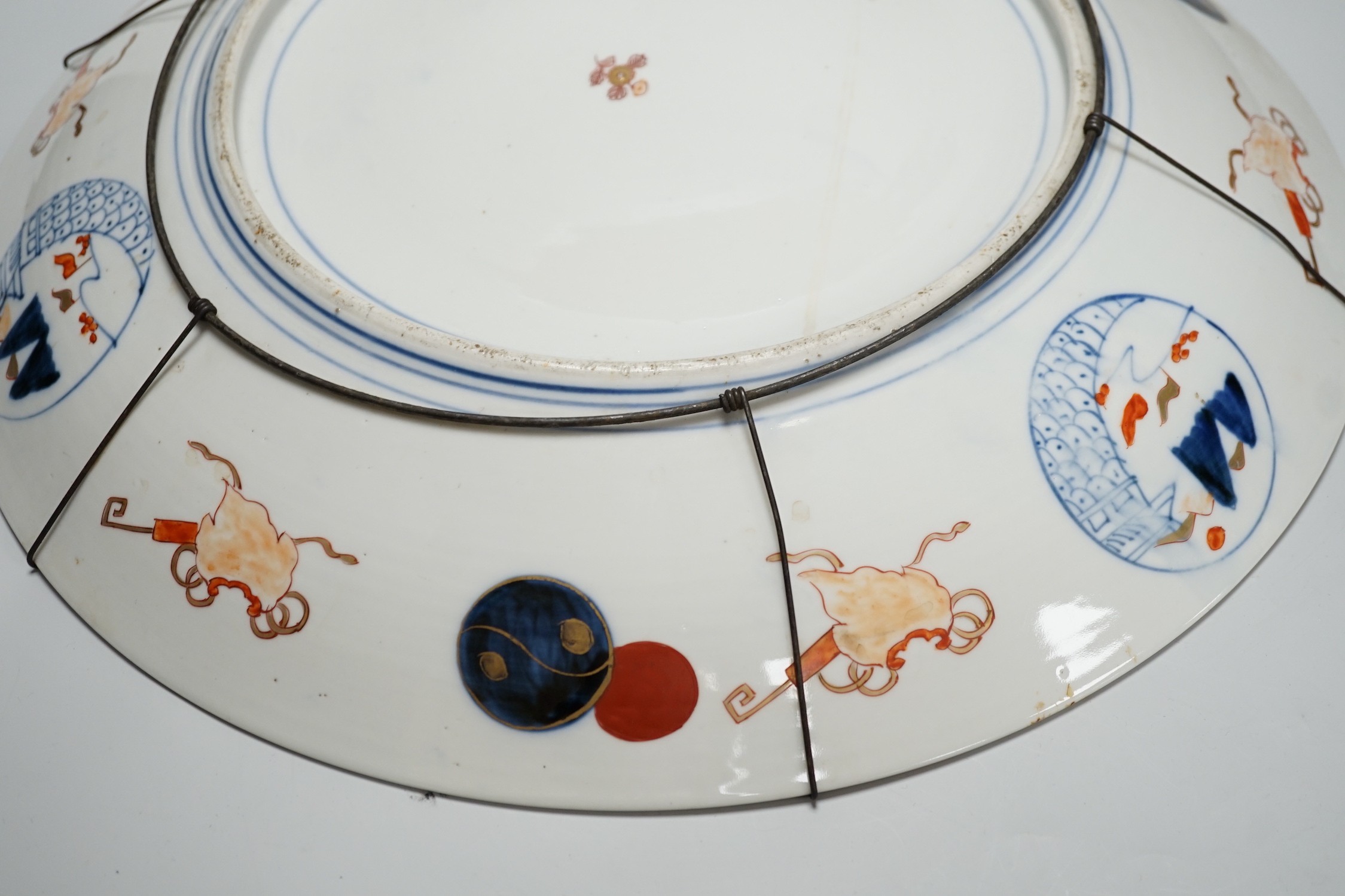 A Japanese Imari ‘dragon and phoenix’ charger, Meiji period, 46cm diameter